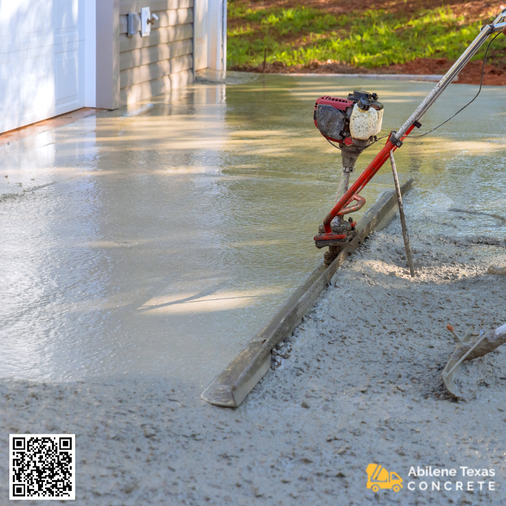 A concrete driveway being poured.