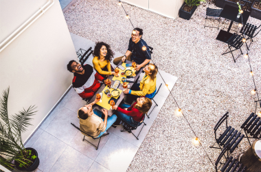 A family eating on a new concrete patio.