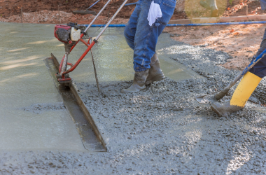 Workers pouring a concrete driveway in Abilene.