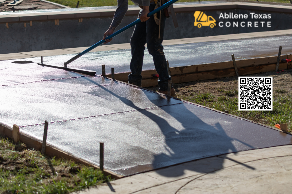 Worker demonstrating the difference between concrete and cement in Abilene, TX.