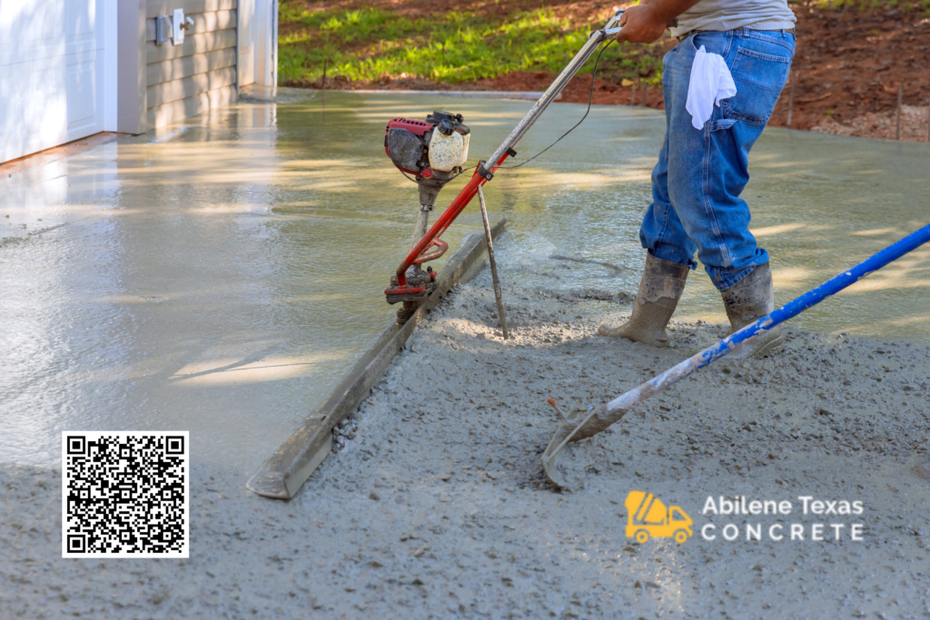 Skilled contractors installing concrete driveways in front of houses.